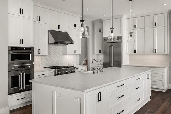 Image of Beautiful White Kitchen with Island and Lots of Cupboards